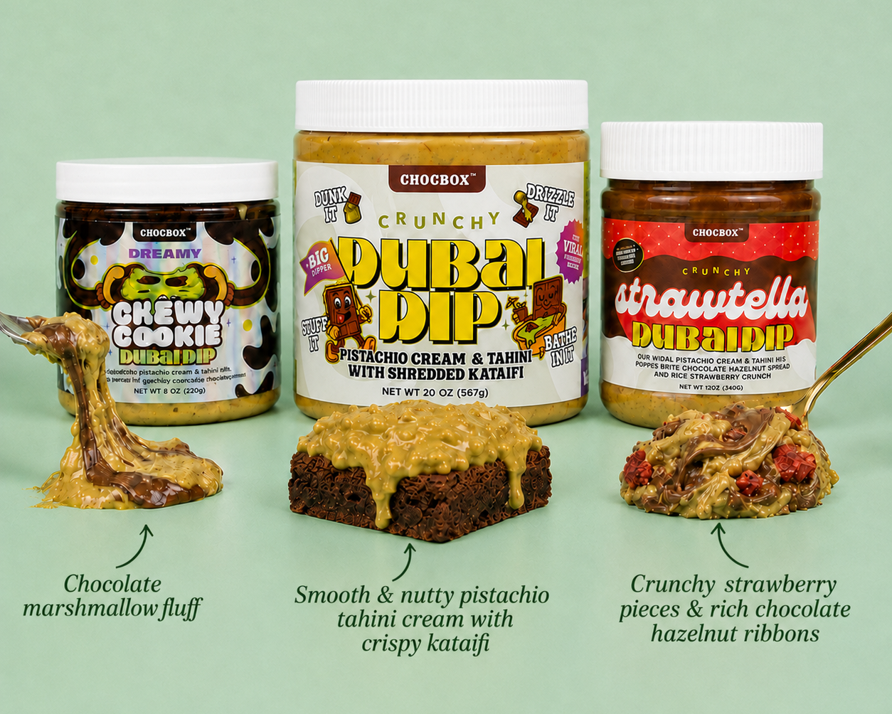 Three jars of Chocbox snack products arranged on a pale green background: a jar of Chewy Cookie Dip on the left with a marshmallow-fluff dip and a spoonful, a jar of Crunchy Dubai Dip in the center with a brownie, and a jar of Crunchy Strawbella Dip on the right with a strawberry hazelnut dip and a spoonful.